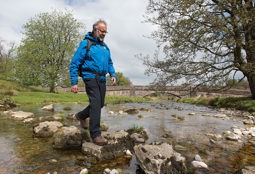 Walker crossing river, photo courtesy of the Nurture Eden photo library